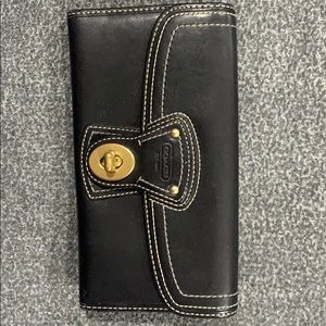 Coach black leather turn lock wallet w/pink inside